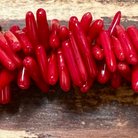 Detail of Red Coral Top and Middle Drilled Drop Beads (ABA-1079)